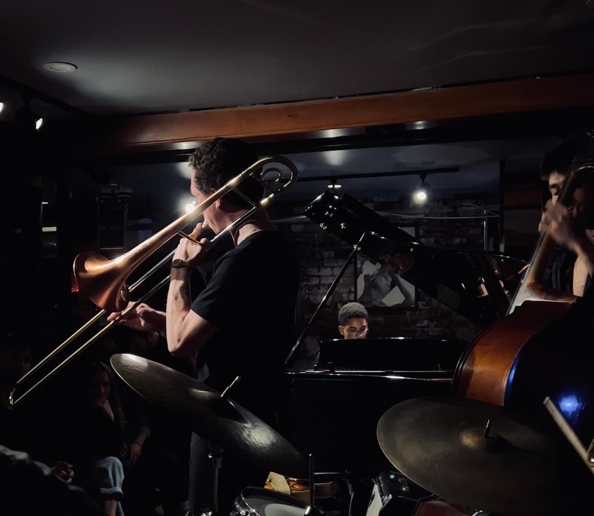 Benny playing trombone with a jazz ensemble at Smalls